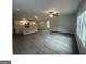 Bright living room flows into a modern kitchen with island, perfect for entertaining at 35 Emerald Ln # 14, Covington, GA 30014