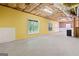 Bright unfinished basement featuring painted walls and windows providing natural light at 2967 Albright Commons, Kennesaw, GA 30144