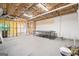 Unfinished basement featuring exposed ceiling insulation and a ping pong table at 2967 Albright Commons, Kennesaw, GA 30144