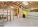 Unfinished basement area featuring exposed framework, utilities, and concrete flooring, ready for customization at 2967 Albright Commons, Kennesaw, GA 30144