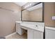 Bathroom vanity featuring a large framed mirror, good lighting, and ample counter space at 2967 Albright Commons, Kennesaw, GA 30144