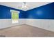 Carpeted bedroom features a window and wainscoting along the lower walls at 2967 Albright Commons, Kennesaw, GA 30144