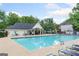 Community swimming pool with lounge chairs and umbrellas, perfect for relaxation and recreation at 2967 Albright Commons, Kennesaw, GA 30144