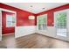 Sunlit dining area featuring hardwood floors, decorative lighting, and white wainscoting at 2967 Albright Commons, Kennesaw, GA 30144