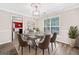 Dining room featuring modern lighting, large window, hardwood floors, and table with seating at 2967 Albright Commons, Kennesaw, GA 30144