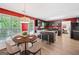 Eat-in kitchen with dark cabinetry, stainless steel appliances, breakfast table, and bright red walls at 2967 Albright Commons, Kennesaw, GA 30144
