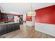 Open kitchen featuring dark cabinetry, granite countertops, stainless steel appliances, and hardwood floors at 2967 Albright Commons, Kennesaw, GA 30144