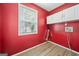 Laundry room featuring white cabinets, wood flooring, and a window at 2967 Albright Commons, Kennesaw, GA 30144