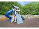 Community playground featuring a slide, climbing wall, and swings for entertainment and recreation at 2967 Albright Commons, Kennesaw, GA 30144