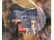 Aerial view of the home showcasing its architectural design and private driveway at 5875 Highway 92, Fairburn, GA 30213
