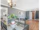 Dining room with hardwood floors, elegant chandelier, and views to kitchen at 5875 Highway 92, Fairburn, GA 30213