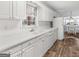 Bright kitchen featuring white cabinets, modern appliances, and great light at 5875 Highway 92, Fairburn, GA 30213
