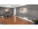 Spacious living room with hardwood floors, elegant chandelier, and neutral paint at 5875 Highway 92, Fairburn, GA 30213