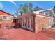Brick home featuring a spacious deck perfect for entertaining or relaxing at 5875 Highway 92, Fairburn, GA 30213