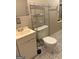 Bathroom features vanity and toilet with storage at 8145 Attleboro Dr, Jonesboro, GA 30238
