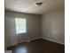 Bedroom features new floors, closet and window for natural light at 8145 Attleboro Dr, Jonesboro, GA 30238