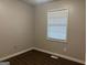 Bedroom featuring wood-look floors and a window at 8145 Attleboro Dr, Jonesboro, GA 30238