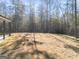 Large backyard with mature trees and an in-ground lawn at 980 Temple Draketown Rd, Temple, GA 30179