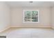 Bright bedroom features neutral walls, plush carpet, and a window with a lush, green view at 980 Temple Draketown Rd, Temple, GA 30179