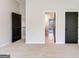 Carpeted bedroom featuring multiple doorways and ample space at 980 Temple Draketown Rd, Temple, GA 30179