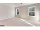 Spacious bedroom with carpet and two windows offering ample natural light at 980 Temple Draketown Rd, Temple, GA 30179
