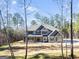 New construction home with a large manicured lawn and mature trees at 980 Temple Draketown Rd, Temple, GA 30179