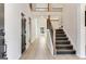 Bright foyer boasts high ceilings, wood-look flooring and a stained wood staircase at 980 Temple Draketown Rd, Temple, GA 30179