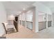 Bright hallway with railing overlooking lower level and recessed lighting throughout at 980 Temple Draketown Rd, Temple, GA 30179