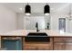 Close-up of the kitchen island with a dark sink and stainless steel dishwasher at 980 Temple Draketown Rd, Temple, GA 30179