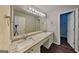 Spacious bathroom featuring granite countertops with double sinks and vanity lighting at 2001 Fairbrook Ln, Woodstock, GA 30189