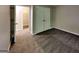 Carpeted bedroom featuring a double-door closet and open doorway to a walk-in closet at 2001 Fairbrook Ln, Woodstock, GA 30189