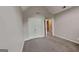 Neutral bedroom features plush carpeting, a vaulted ceiling and a double-door closet at 2001 Fairbrook Ln, Woodstock, GA 30189