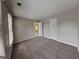 Cozy bedroom with plush carpet, neutral walls, and bright natural light from large windows at 2001 Fairbrook Ln, Woodstock, GA 30189