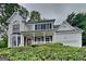 Charming two-story home with a covered front porch and stone accents at 2001 Fairbrook Ln, Woodstock, GA 30189