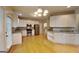 Spacious kitchen with white cabinets, stainless steel appliances, and hardwood floors at 2001 Fairbrook Ln, Woodstock, GA 30189