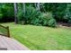 Spacious backyard featuring beautiful lawn at 908 Huntington Pl, Peachtree City, GA 30269
