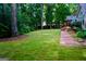 Spacious backyard featuring beautiful lawn at 908 Huntington Pl, Peachtree City, GA 30269
