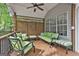 Relaxing covered deck with comfortable green seating and lattice privacy screen at 908 Huntington Pl, Peachtree City, GA 30269