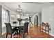 Dining area featuring a round table, seating for four, and modern light fixture at 908 Huntington Pl, Peachtree City, GA 30269