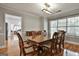 Formal dining room with wood floors, light gray walls, and modern lighting at 908 Huntington Pl, Peachtree City, GA 30269