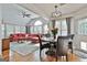 Inviting living room with a vaulted ceiling, large windows, and hardwood floors at 908 Huntington Pl, Peachtree City, GA 30269