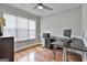 Home office space with natural light from large window and contemporary desk setup at 908 Huntington Pl, Peachtree City, GA 30269