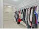 Spacious walk-in closet with ample shelving and hanging space for organization at 908 Huntington Pl, Peachtree City, GA 30269