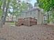 Expansive backyard features a large deck, mature trees, and a well-maintained lawn, perfect for outdoor entertaining at 302 Welton Way, Peachtree City, GA 30269