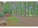 Spacious backyard featuring a deck and mature trees, providing a private outdoor retreat at 302 Welton Way, Peachtree City, GA 30269