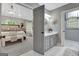 View from main bedroom into ensuite bathroom, with a gray vanity and white marble floors at 302 Welton Way, Peachtree City, GA 30269