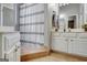 Bright bathroom featuring vanity, shower with curtain, and neutral color palette at 302 Welton Way, Peachtree City, GA 30269