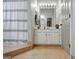 Bright bathroom featuring vanity, shower with curtain, and neutral color palette at 302 Welton Way, Peachtree City, GA 30269