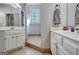 Bright bathroom with tiled floor, double vanity, and neutral paint at 302 Welton Way, Peachtree City, GA 30269