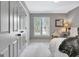 Bedroom with ample natural light, plush carpet, and a comfortable reading nook at 302 Welton Way, Peachtree City, GA 30269